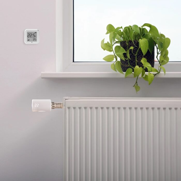 Product-26158-stock-photo-beautiful-houseplant-on-window-sill-and-modern-radiator-at-home-central-heating-system-2162693117-7-938x9381-1